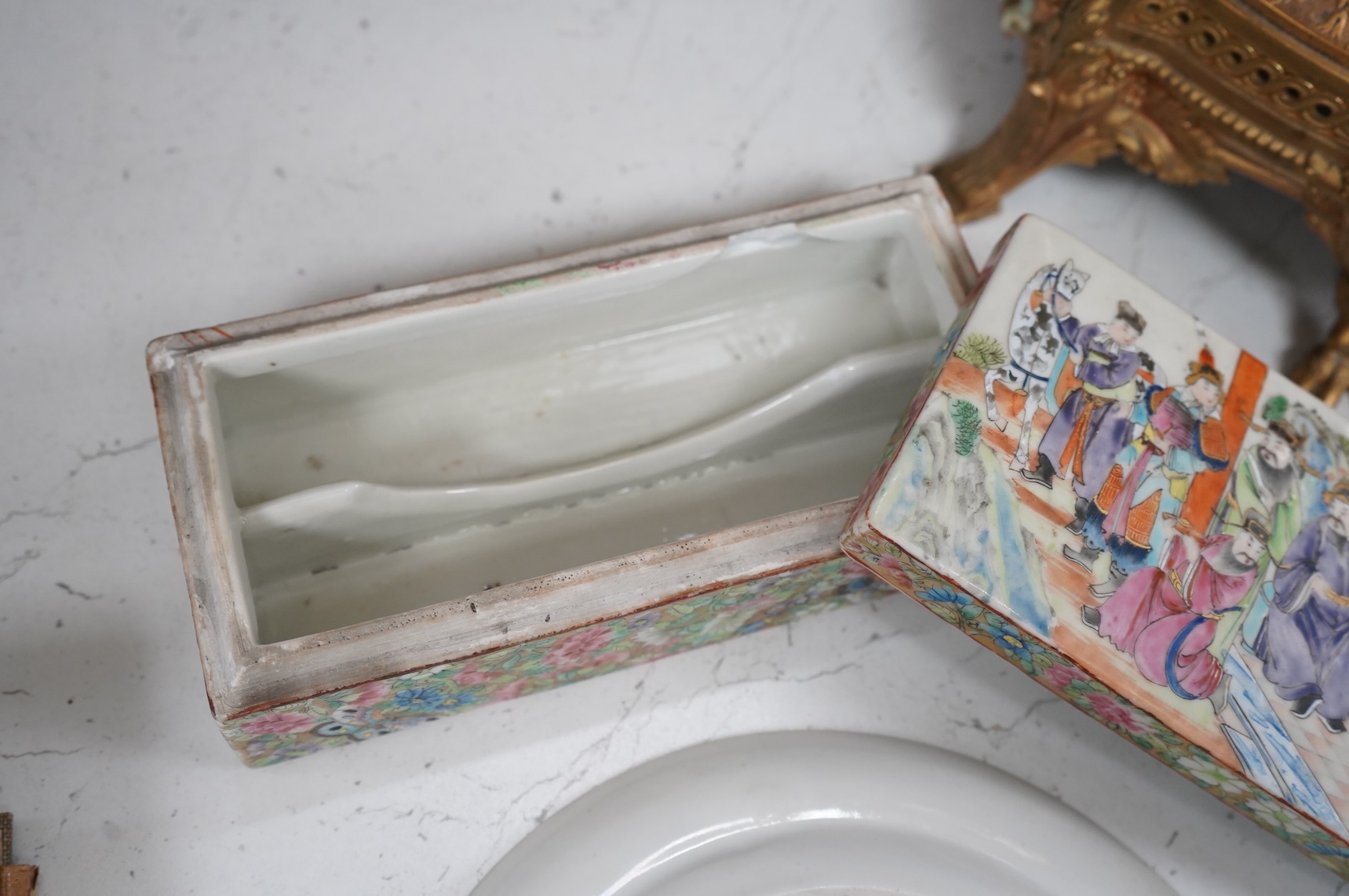 A Chinese famille rose pen box, and a similar plate, c.1830, 19.5cm wide